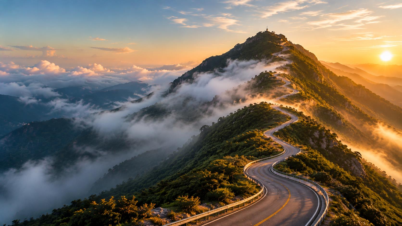 A winding mountain road climbing toward the summit
